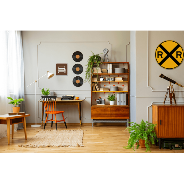 An office with plants, records and signs on the walls.