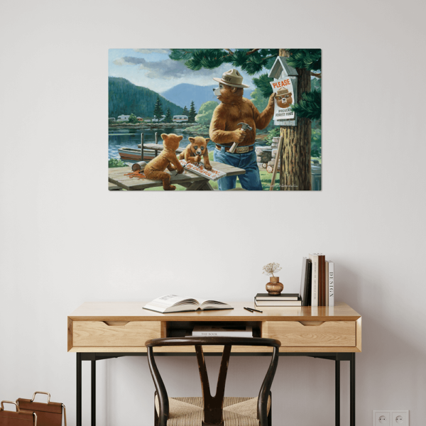 A Smokey Bear aluminum art print hung up on a wall to show what it looks like in an interior space.