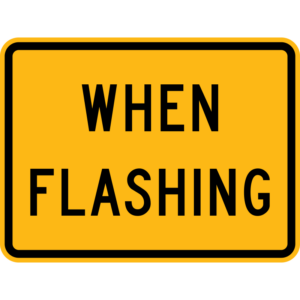 W16-13P When Flashing Plaque Sign