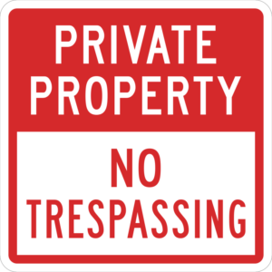 Red and white private property no trespassing sign