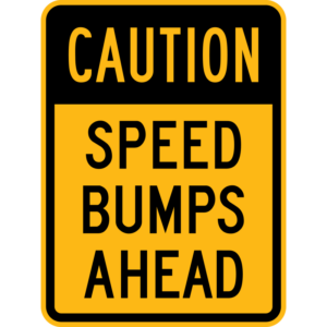 Caution Speed Bumps Ahead Sign