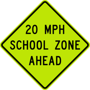 Lime green school zone sign