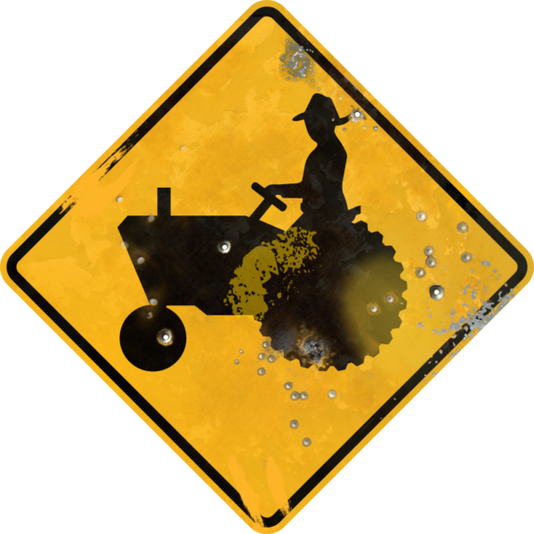 Street Sign with Tractor and Driver Crossing symbol. Vintage looking sign with digitally printed bullet holes.