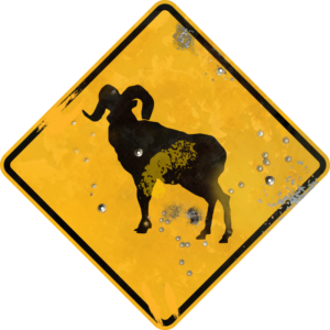 Street Sign with Mountain Goat crossing symbol. Vintage looking sign with digitally printed bullet holes.