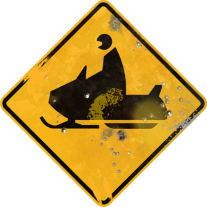 Street Sign with Snowmobile Crossing symbol. Vintage looking sign with digitally printed bullet holes.