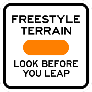 Square ski sign that Says " Freestyle terrain look before you leap"