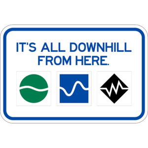 Horizontal rectangular ski Sign with blue and white boarder that says "its all downhill from here"