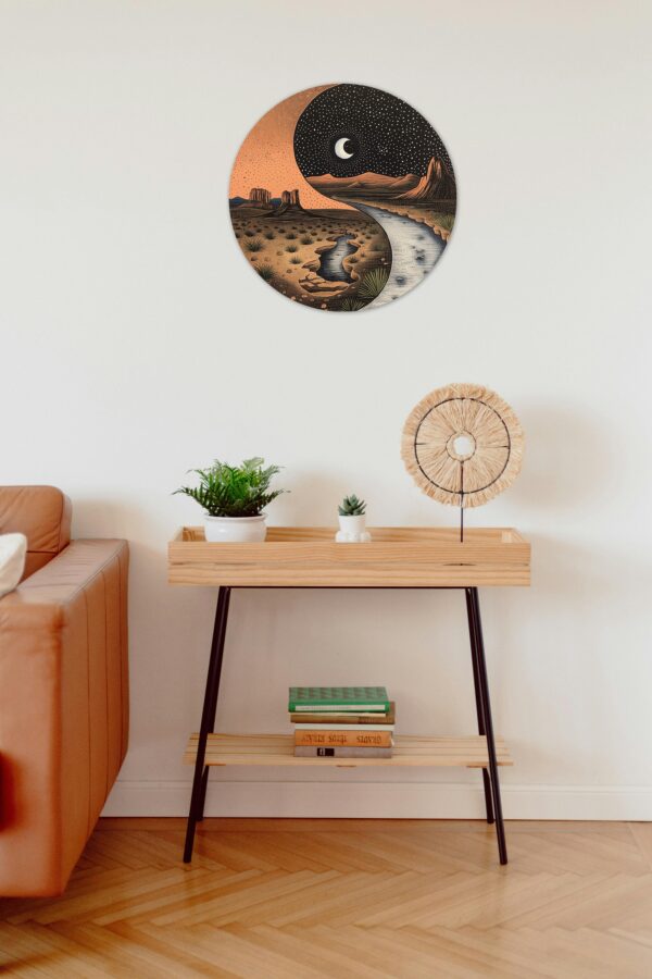 A circular sign hung up on a wall above a small table with a plant and books on the shelves.